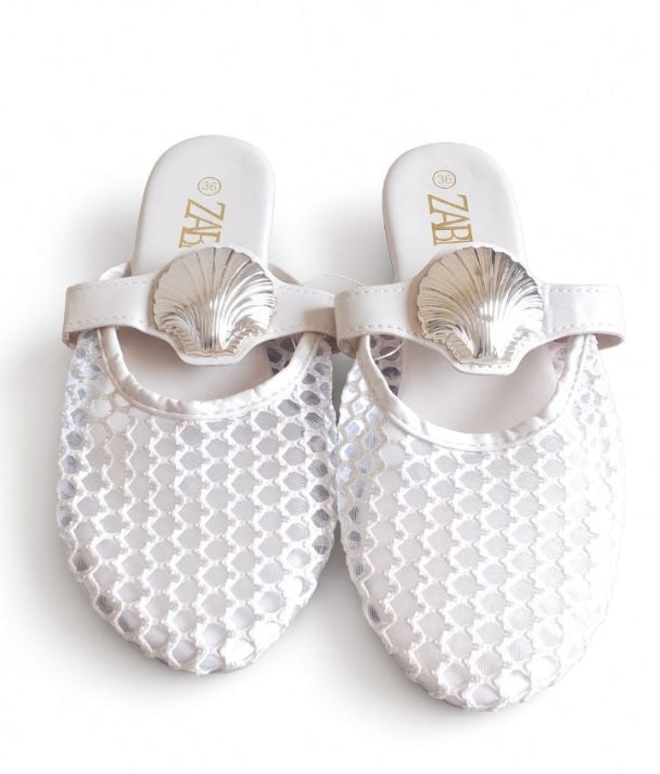 White mesh mules – shell buckle
